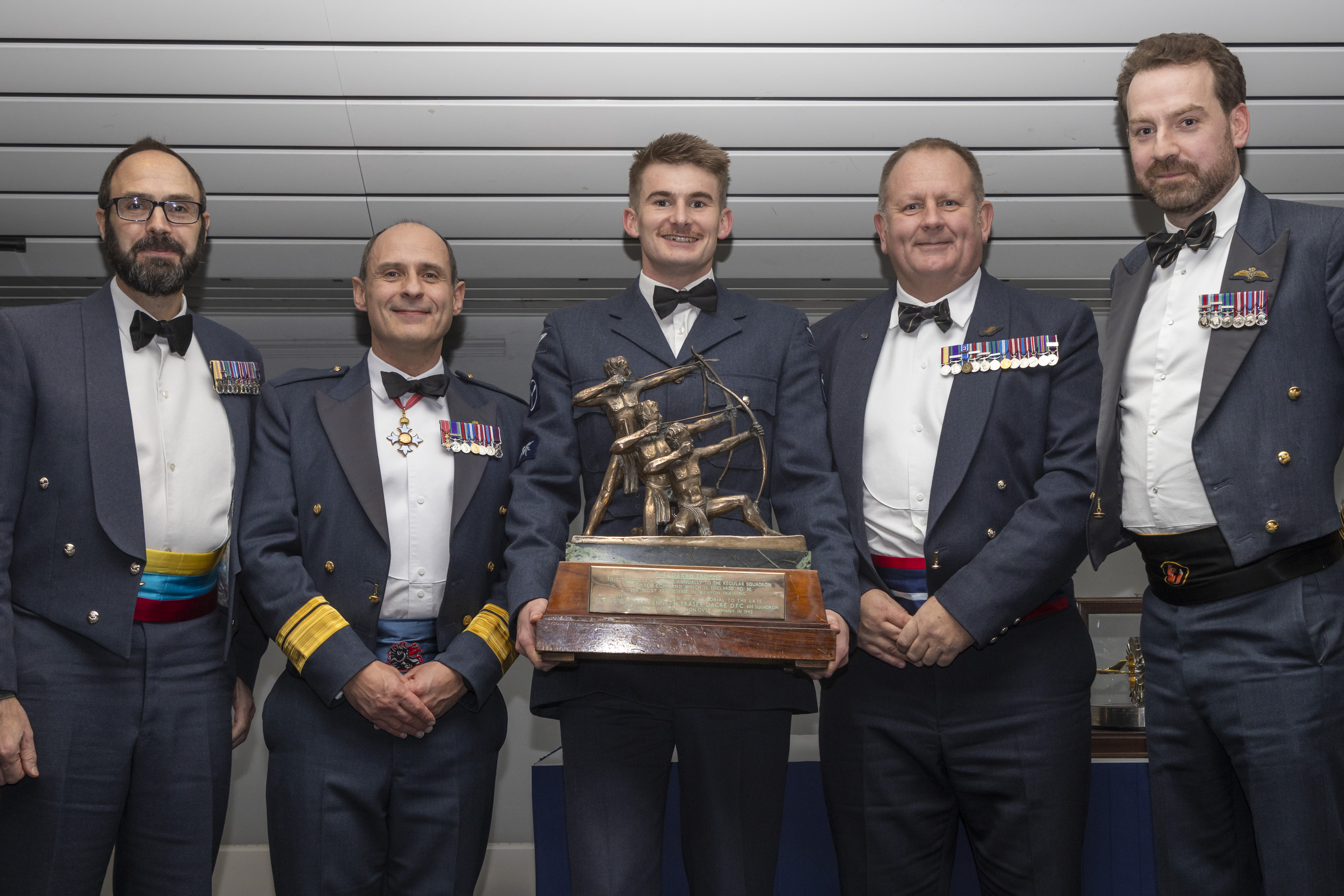 Former members of 47 Squadron collecting The Dacre Trophy